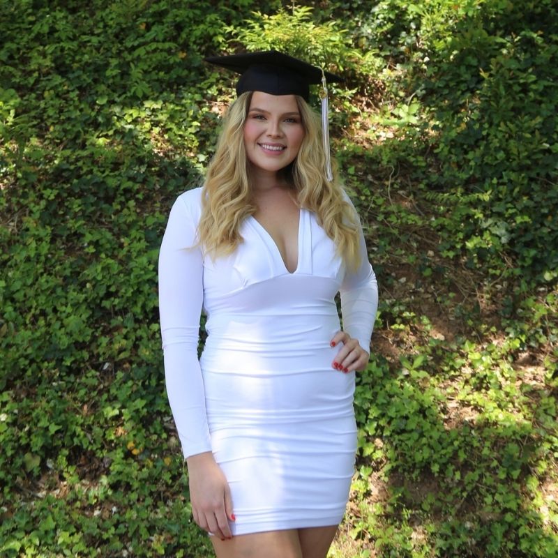 Headshot of Evelyn Pike wearing a mortarboard.